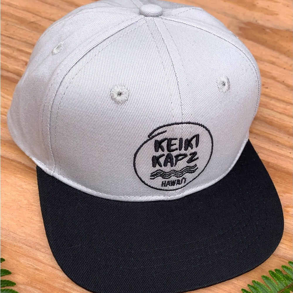 Grey and black keiki kapz snapback hat